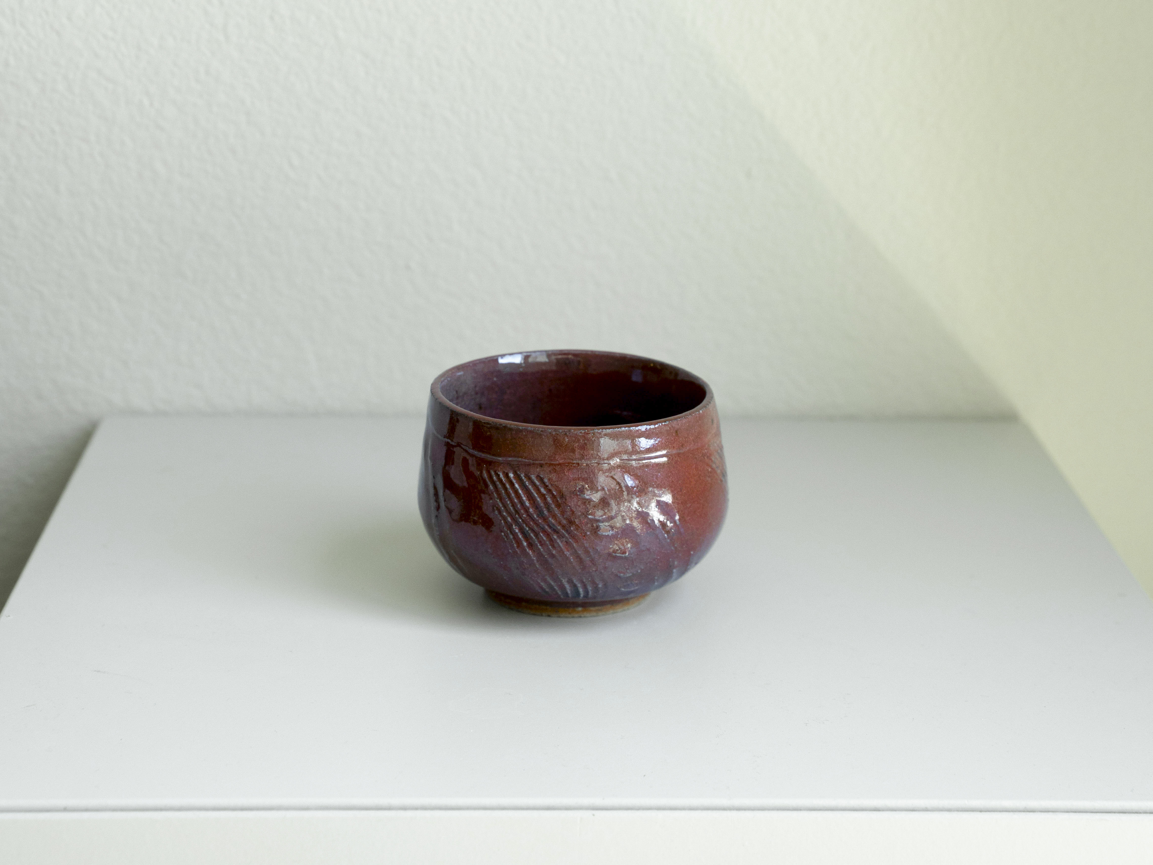 Iron Red Carved Tea Bowl, main view