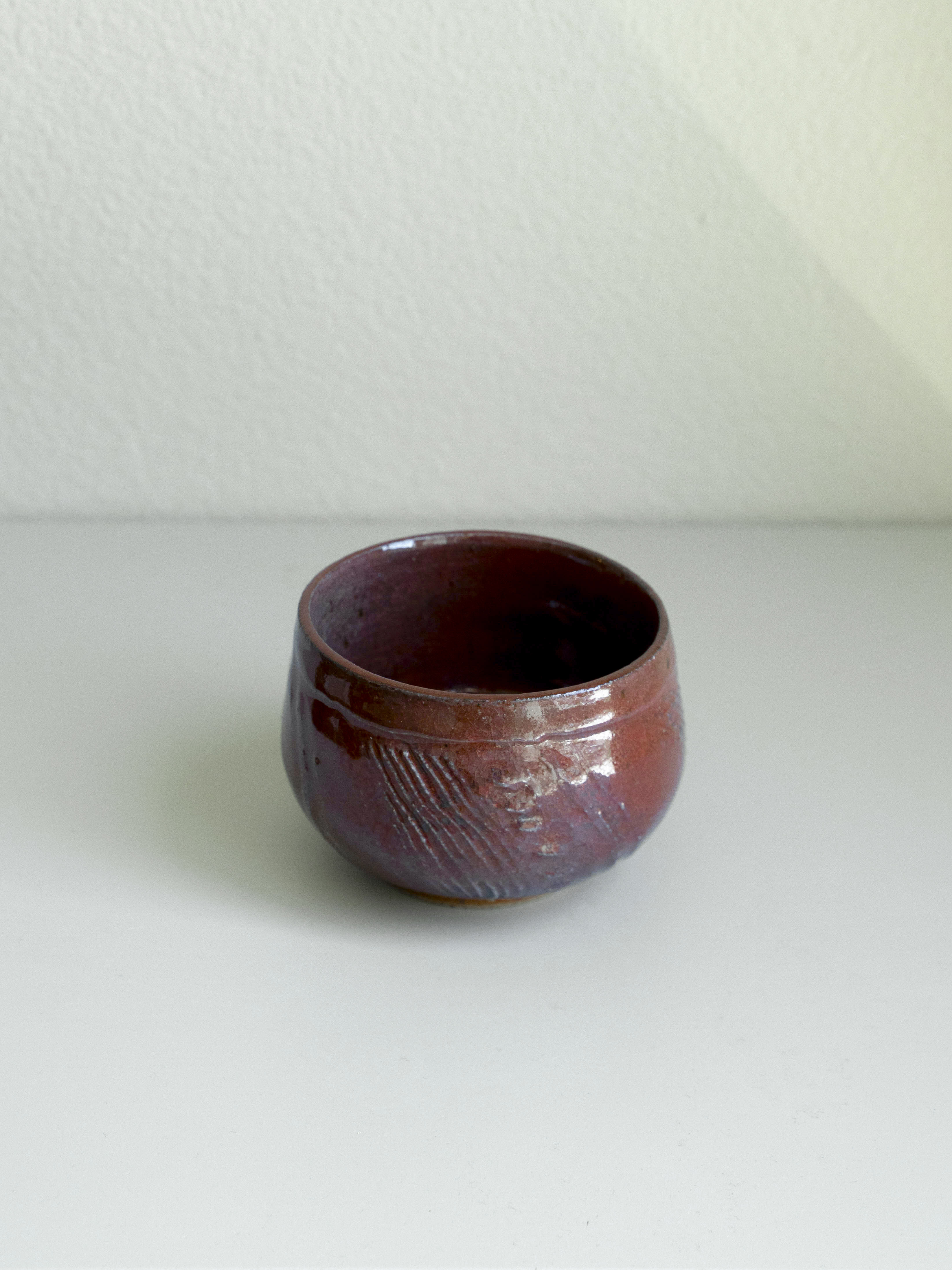 Iron Red Carved Tea Bowl, detail 1