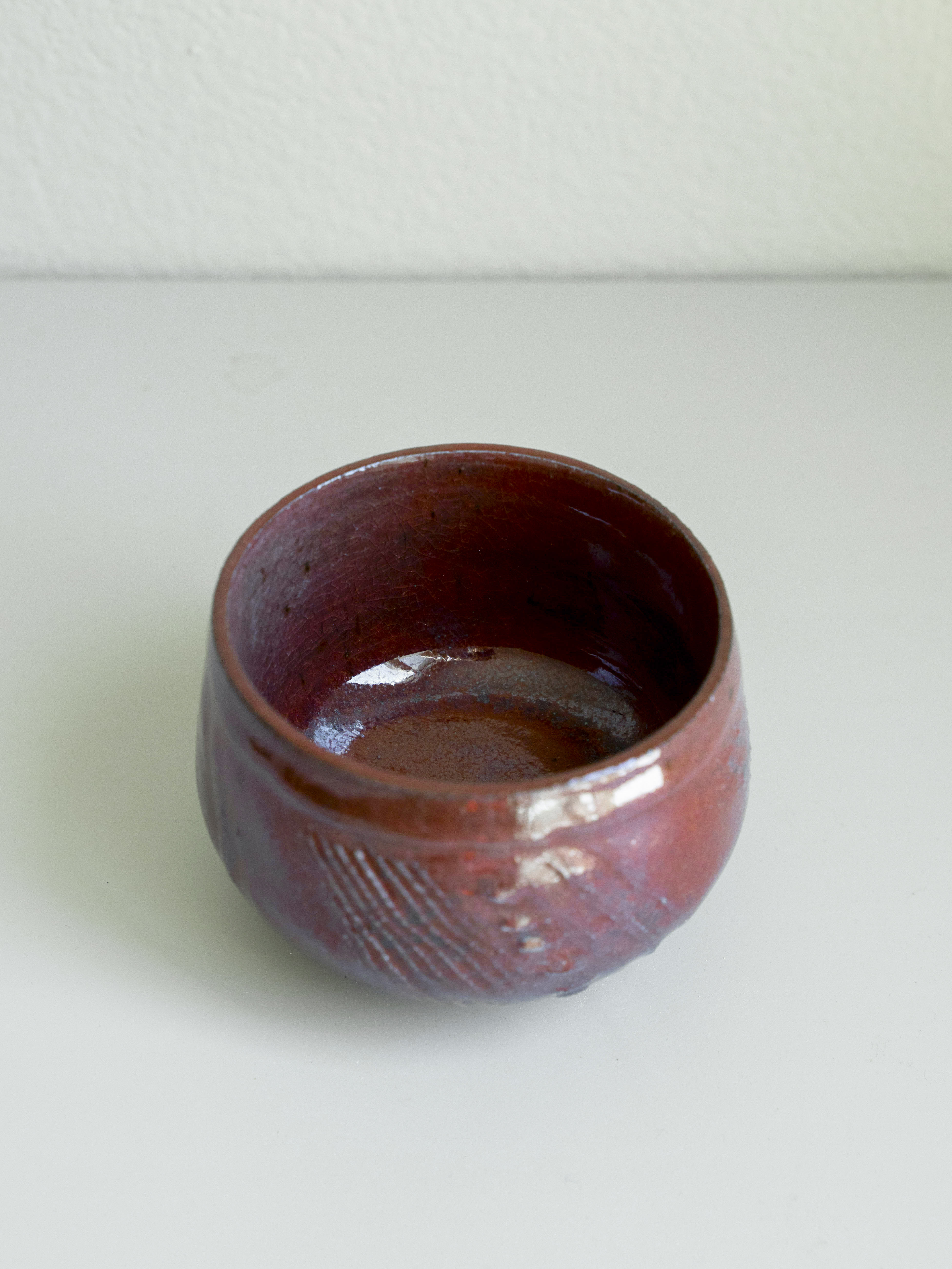 Iron Red Carved Tea Bowl, detail 2