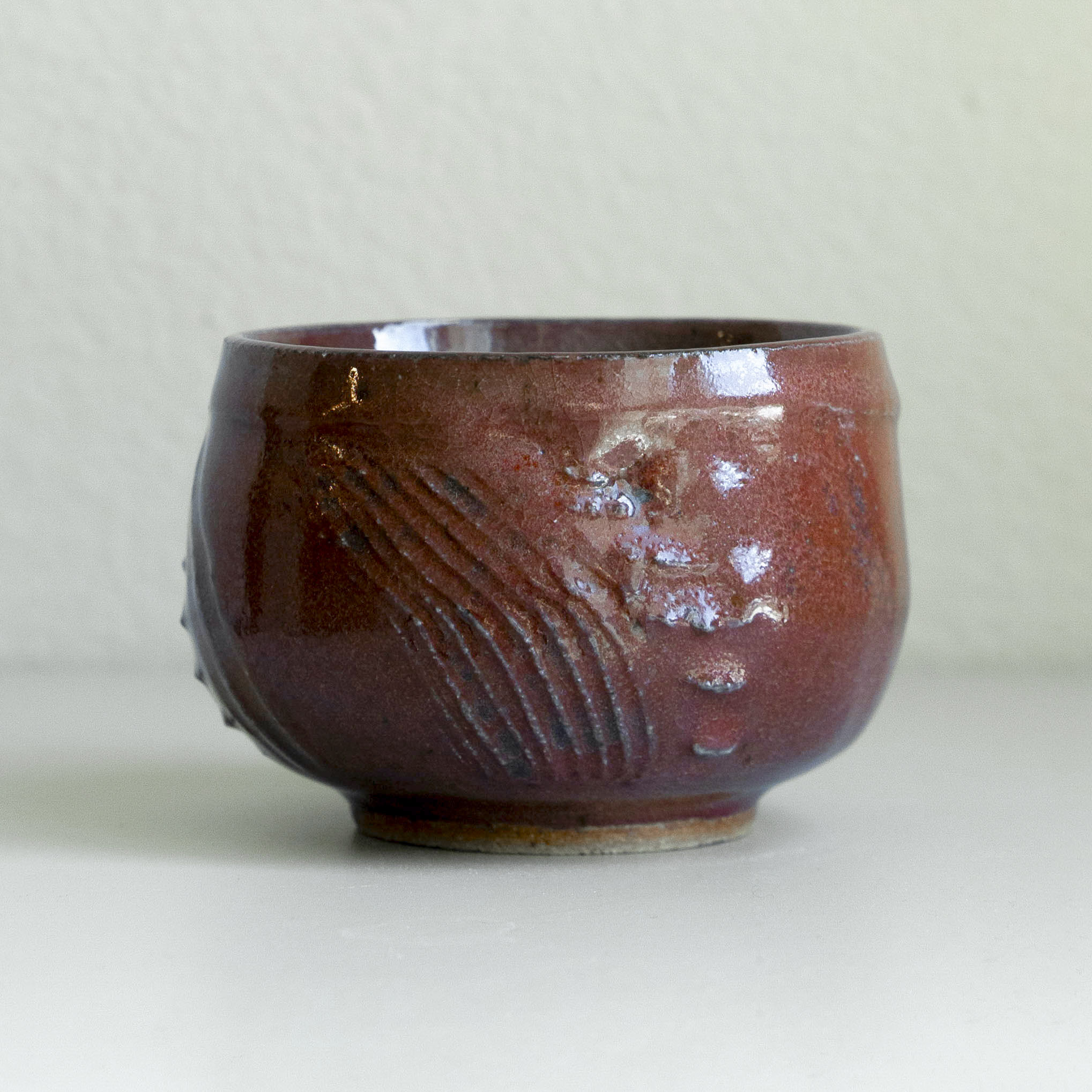 Iron Red Carved Tea Bowl, detail 3