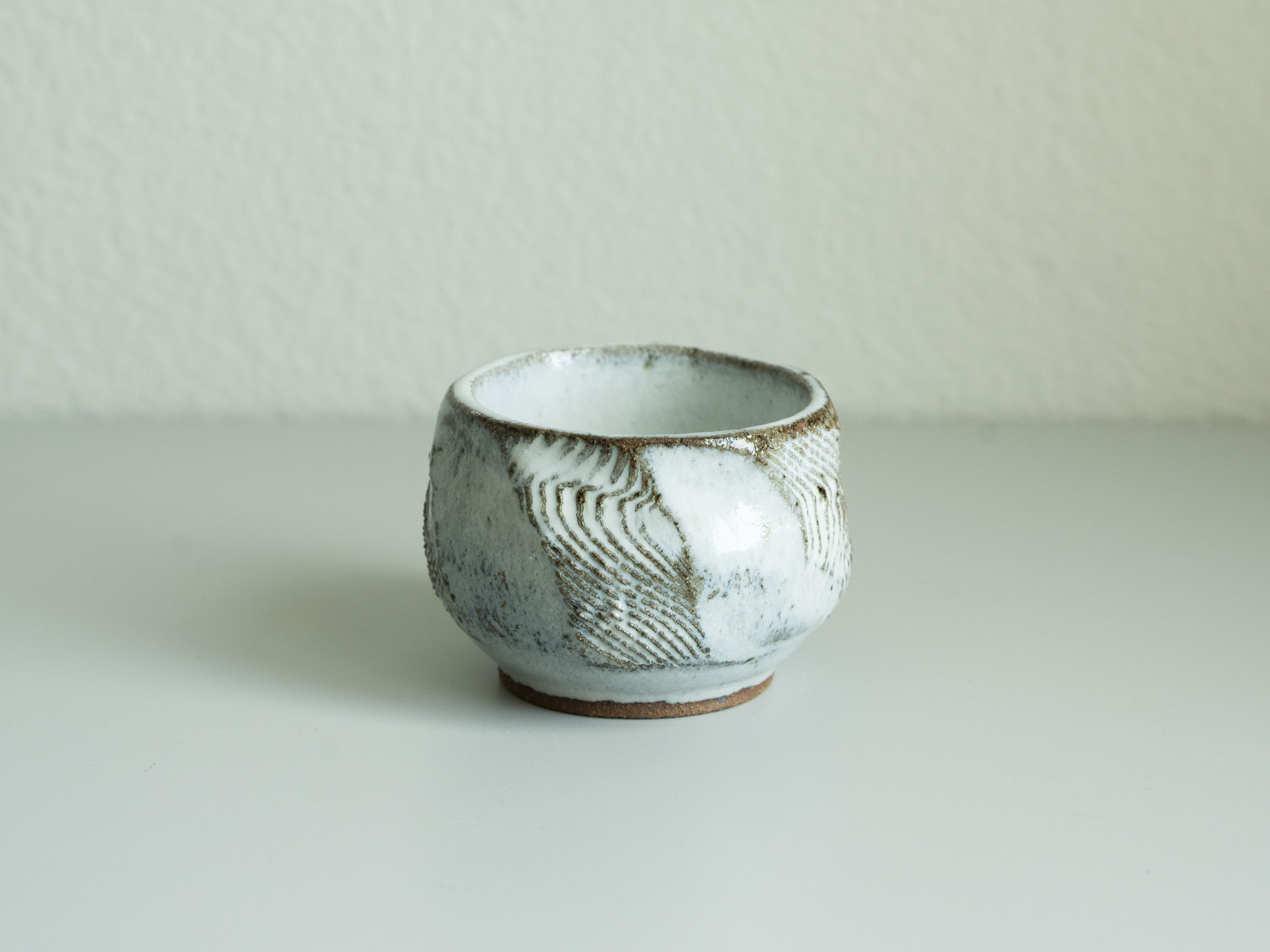 White Glazed Carved Tea Cup, main view