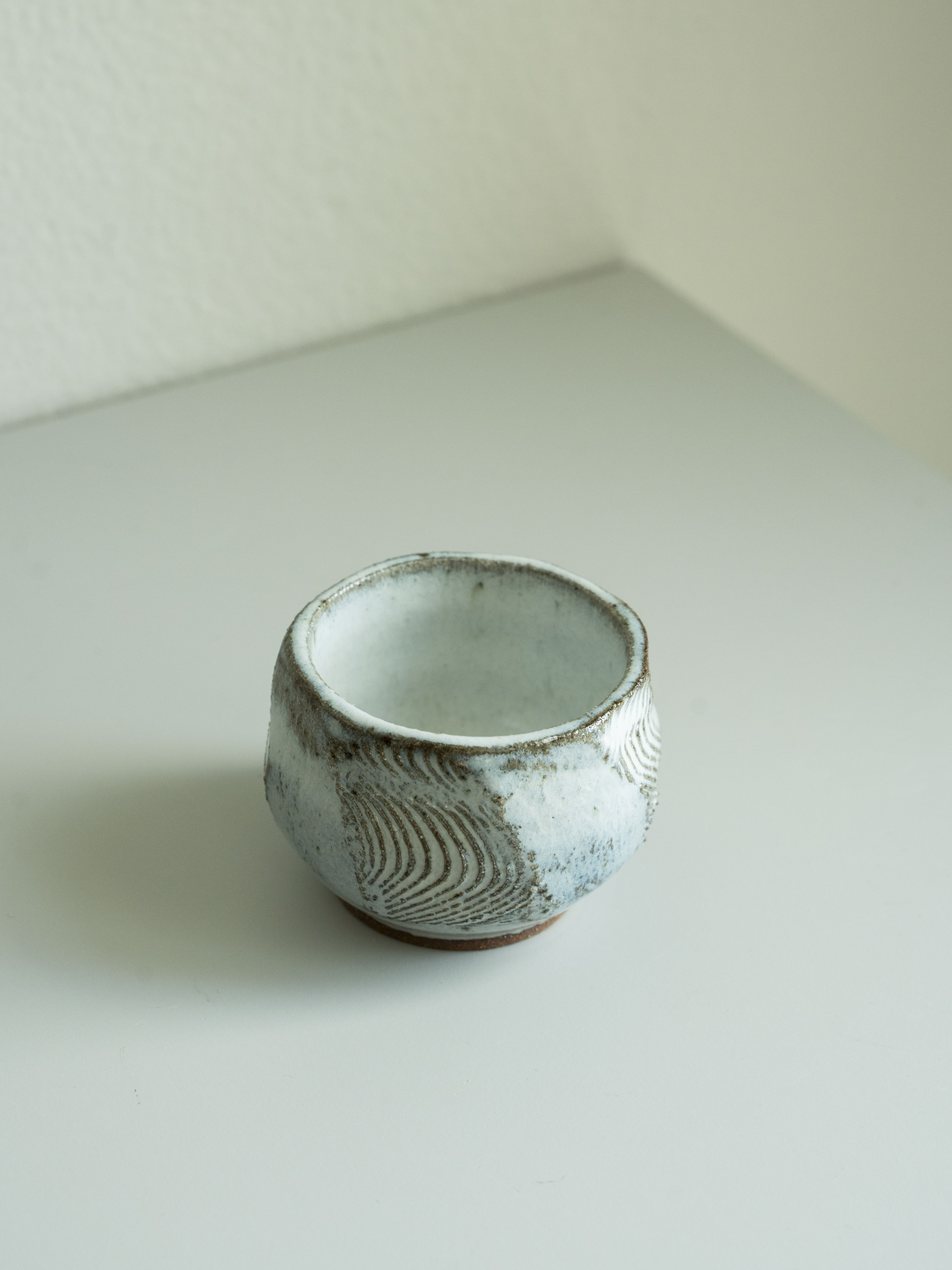 White Glazed Carved Tea Cup, detail 1
