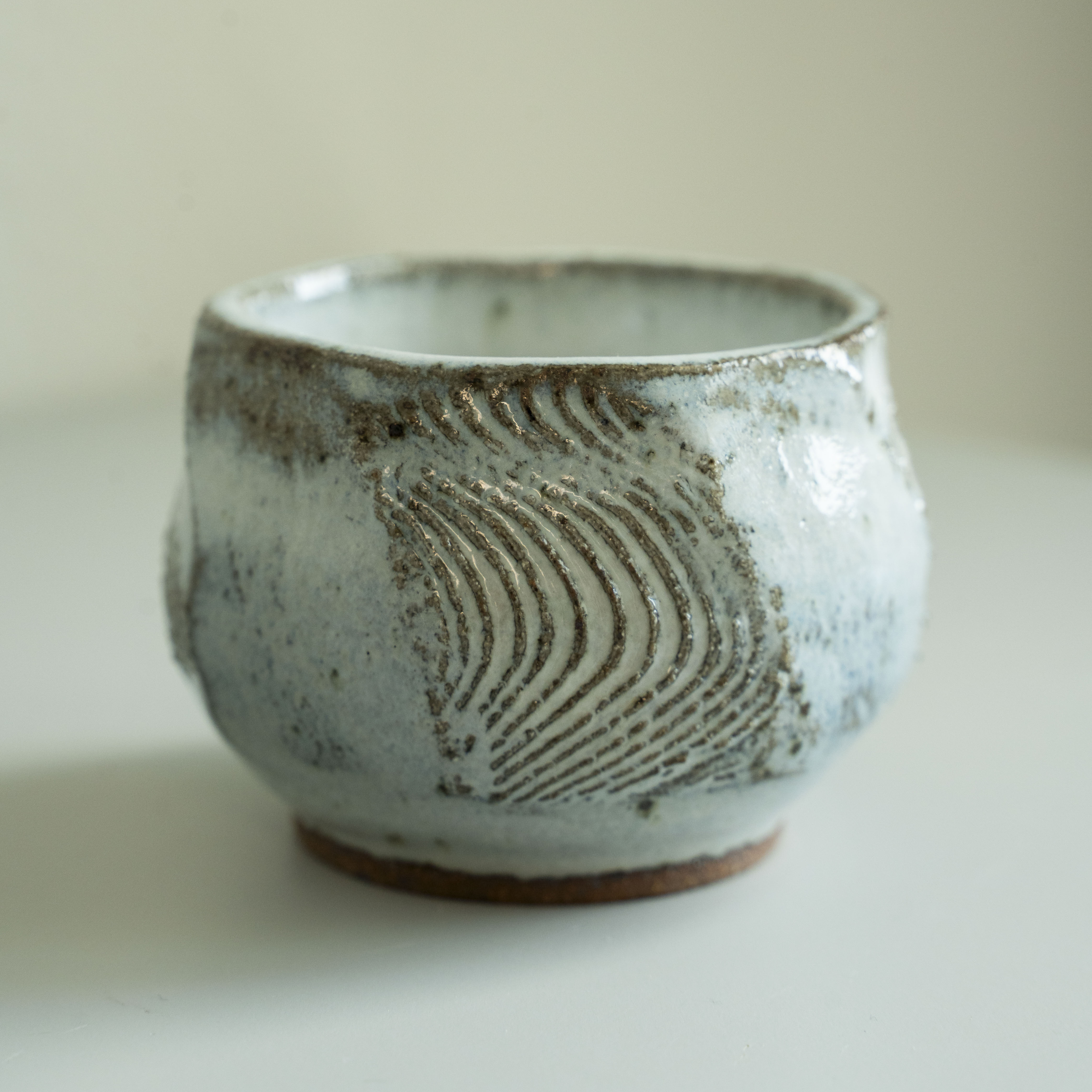 White Glazed Carved Tea Cup, detail 3