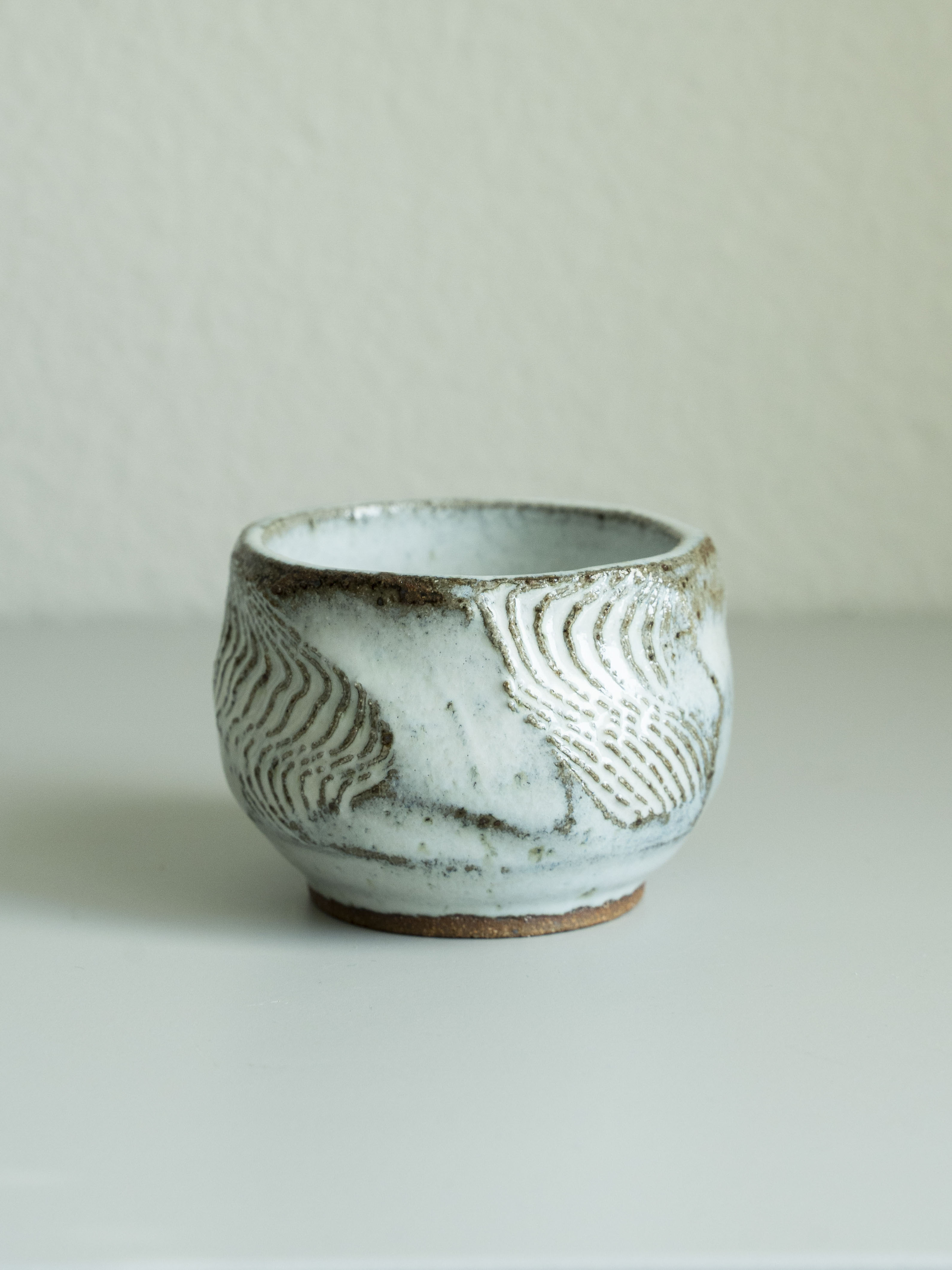 White Glazed Carved Tea Cup, detail 2